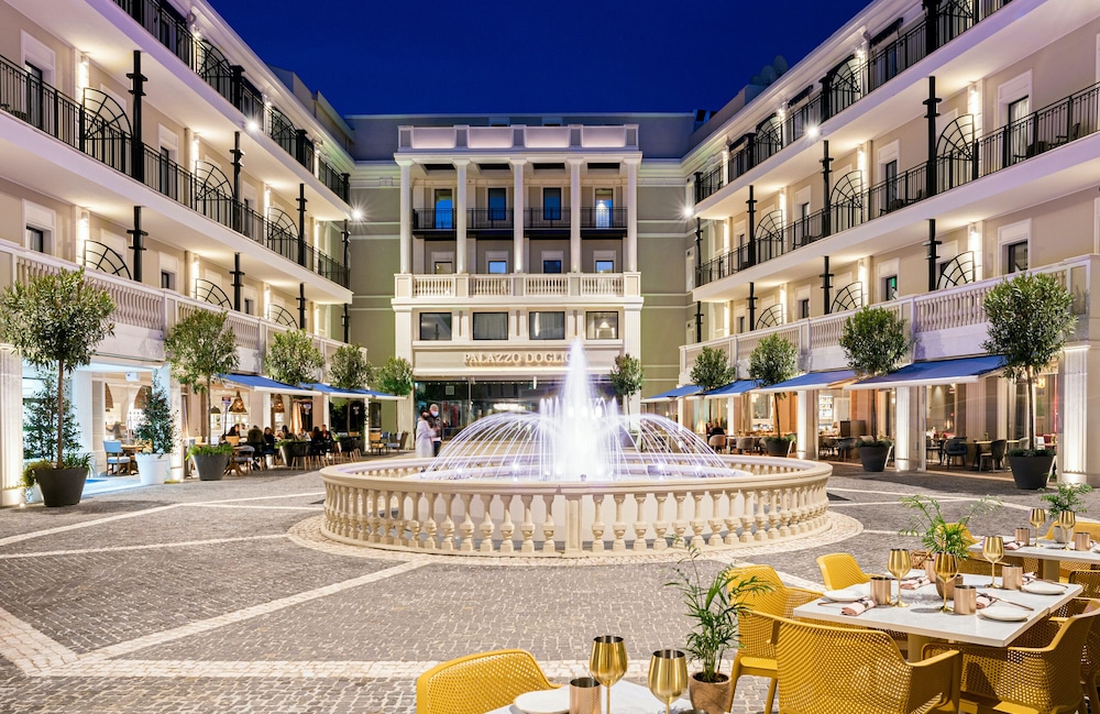 a picture of Palazzo Doglio's courtyard and fountain